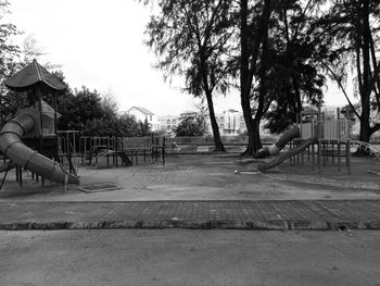 Playground in park against sky
