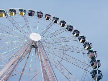 Low angle view of ferris wheel against sky