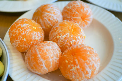 Close-up of orange fruits in plate