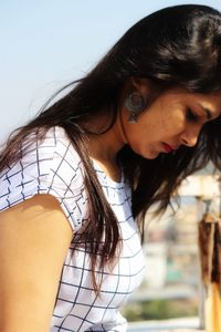 Portrait of beautiful young woman standing outdoors