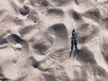 High angle view of an astic soldier on beach