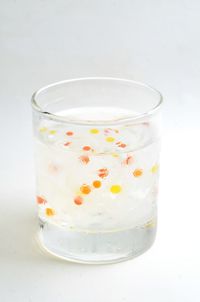 Close-up of drink against white background