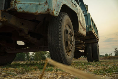 Close-up of damaged car on field