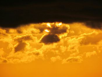 Scenic view of cloudy sky at sunset