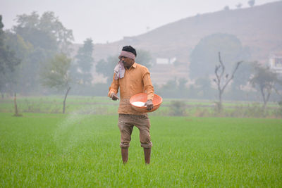 Full length of man standing on field