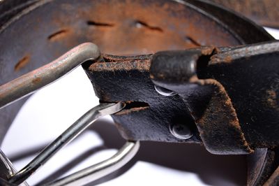 Worn out discarded belt from man's pants