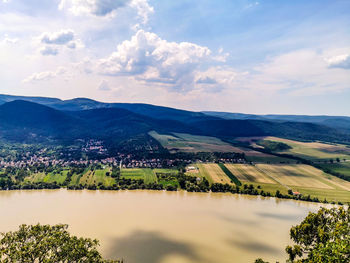 Scenic view of landscape and mountains against sky