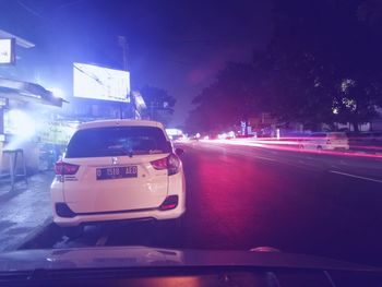 Cars on road at night