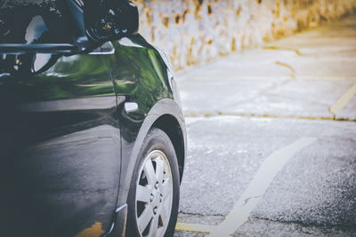 Low section of car on road