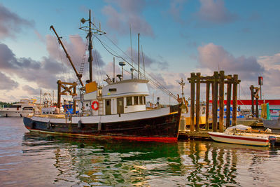 Boats moored at harbor