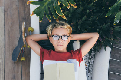 Portrait of boy wearing hat on wood