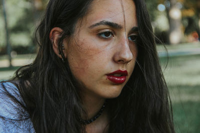 Close-up of young woman with red lipstick