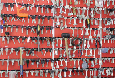 Full frame shot of red flags hanging against wall