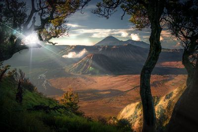 Scenic view of landscape against cloudy sky