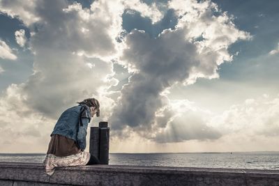 Scenic view of sea against cloudy sky