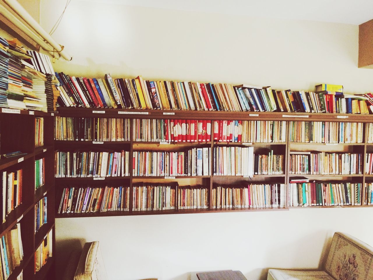 indoors, book, education, shelf, variation, large group of objects, architecture, built structure, arrangement, bookshelf, multi colored, home interior, order, in a row, no people, table, choice, balcony, abundance, library