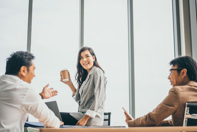 Group of people sitting on table