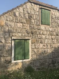 Low angle view of window on old building