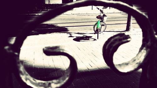 Shadow of man on bicycle