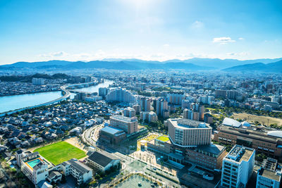 High angle view of buildings in city against sky