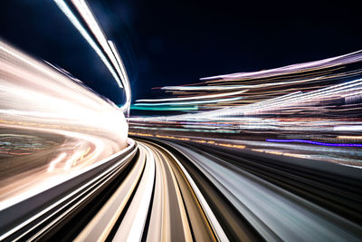 Light trails on illuminated city at night