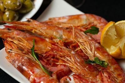 Plate with prawns in the foreground