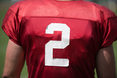 Rear view of woman wearing number 2 sports jersey