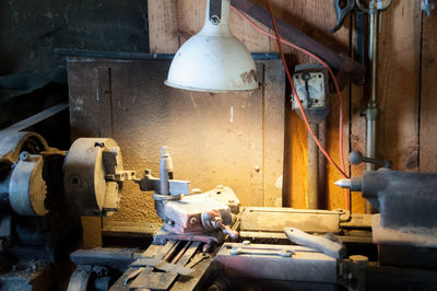 High angle view of machinery and lighting equipment in factory