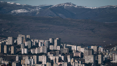 High angle view of buildings in city against sky