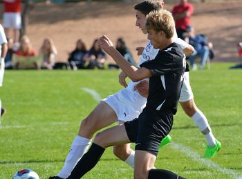 Full length of people on soccer field