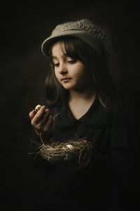 Portrait of young woman looking away