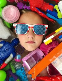 Portrait of girl with colorful toys