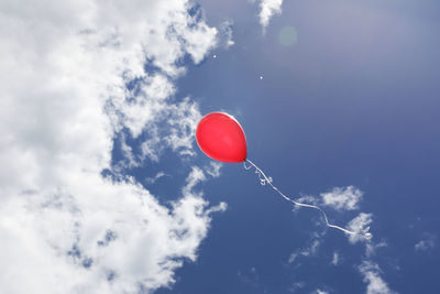 Low angle view of balloons against sky