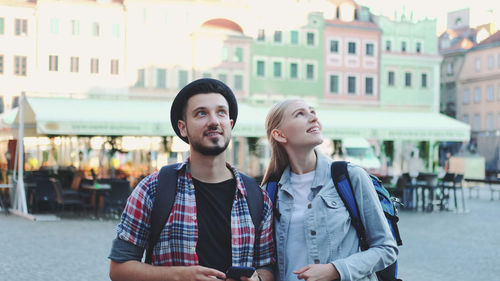 Young couple standing in city