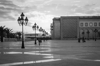 People in city against sky