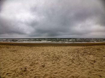 Scenic view of beach against sky