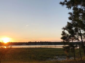 Scenic view of lake against sky during sunset