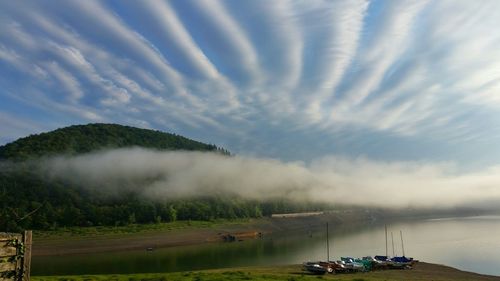 Scenic view of mountains against cloudy sky