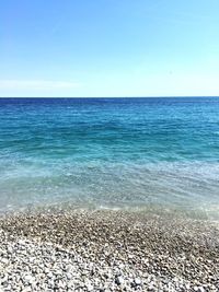 Scenic view of sea against clear blue sky