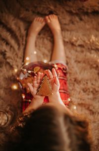 High angle view of girl holding decoration