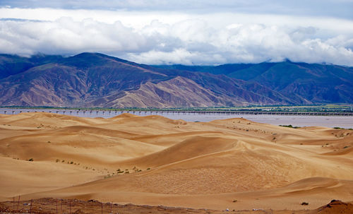 Scenic view of desert against sky