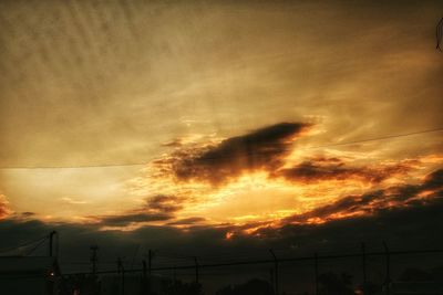 Low angle view of cloudy sky at sunset