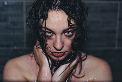 Portrait of beautiful young woman in bathroom