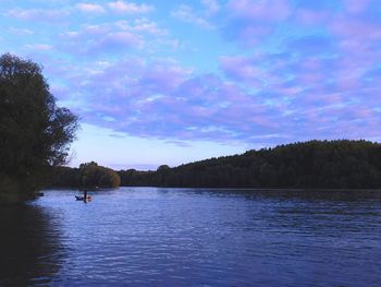 Scenic view of lake against cloudy sky