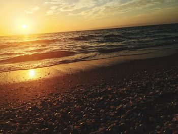 Scenic view of sea at sunset