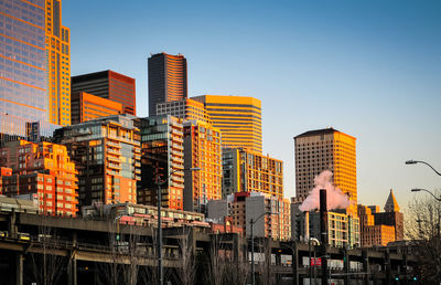 Low angle view of buildings against sky during sunset