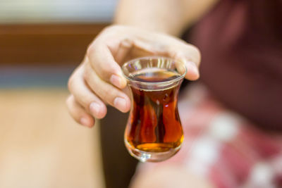 Close-up of hand holding drink