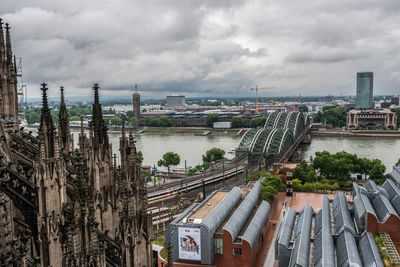 High angle view of cologne cathedral and hohenzollern bridge in city