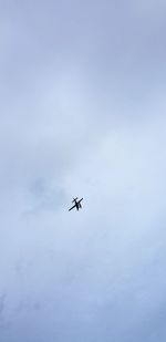 Low angle view of airplane flying in sky