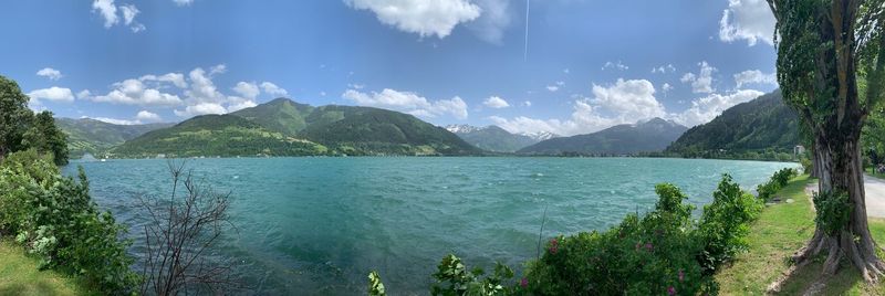 Panoramic view of sea and mountains against sky